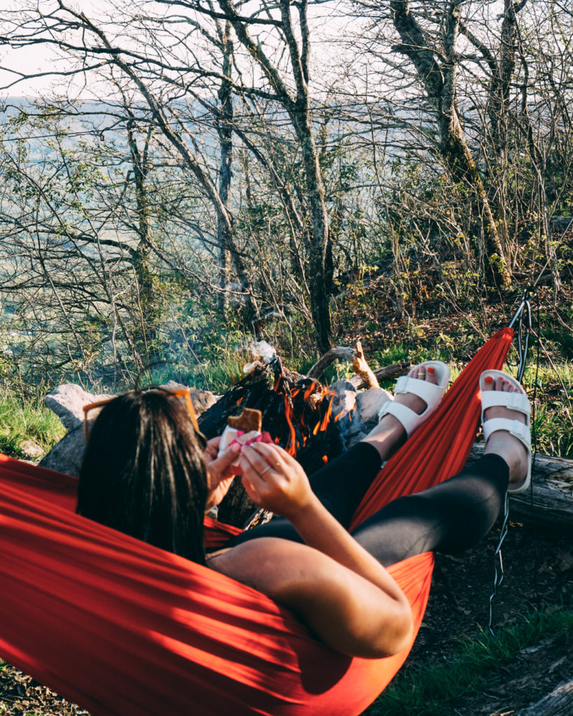 Enjoying a campfire from a hammock