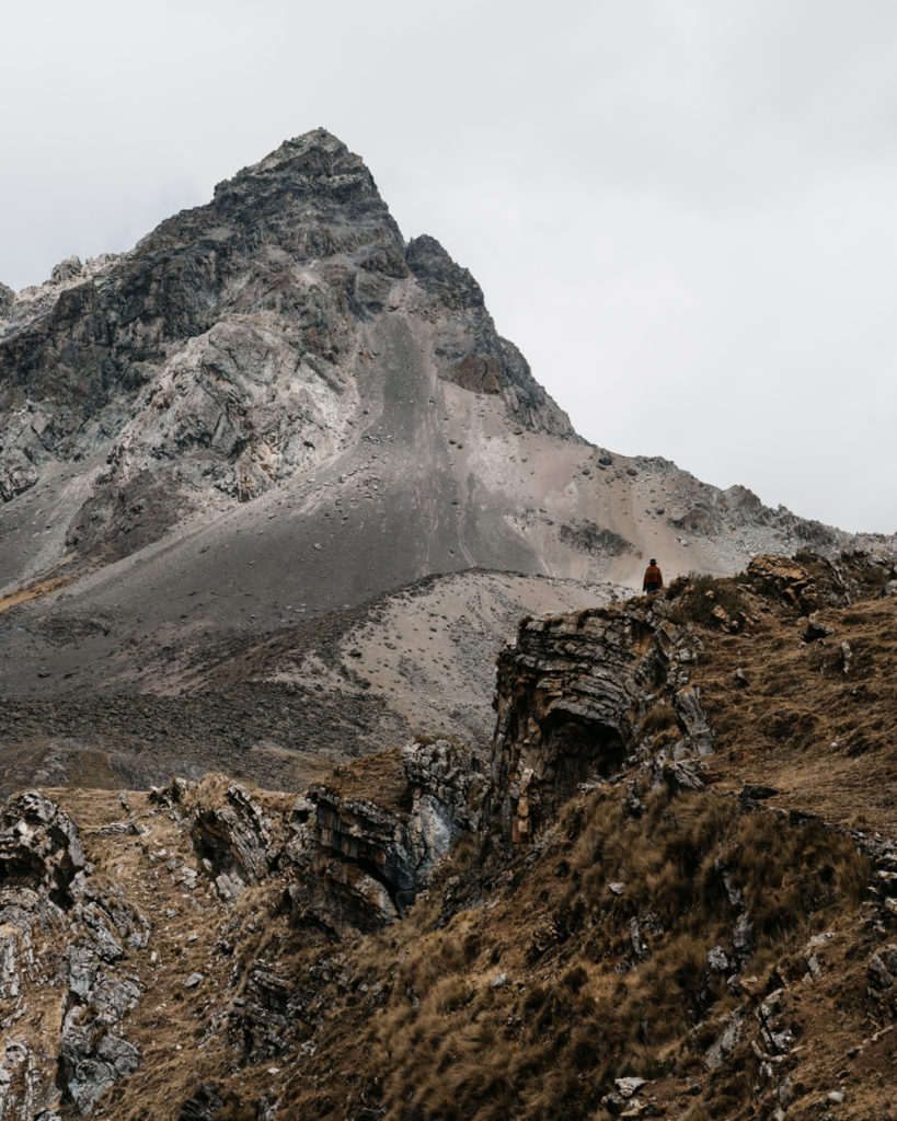 Farmer standing in front of mountain on Huayhuash trek Peru