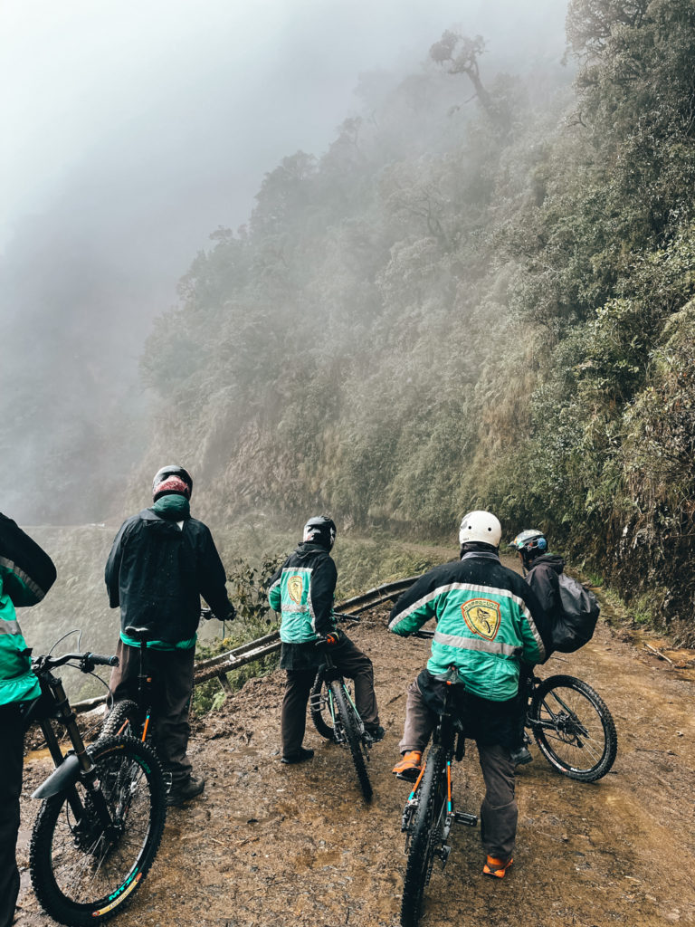 Tourists biking Death Road in Bolivia