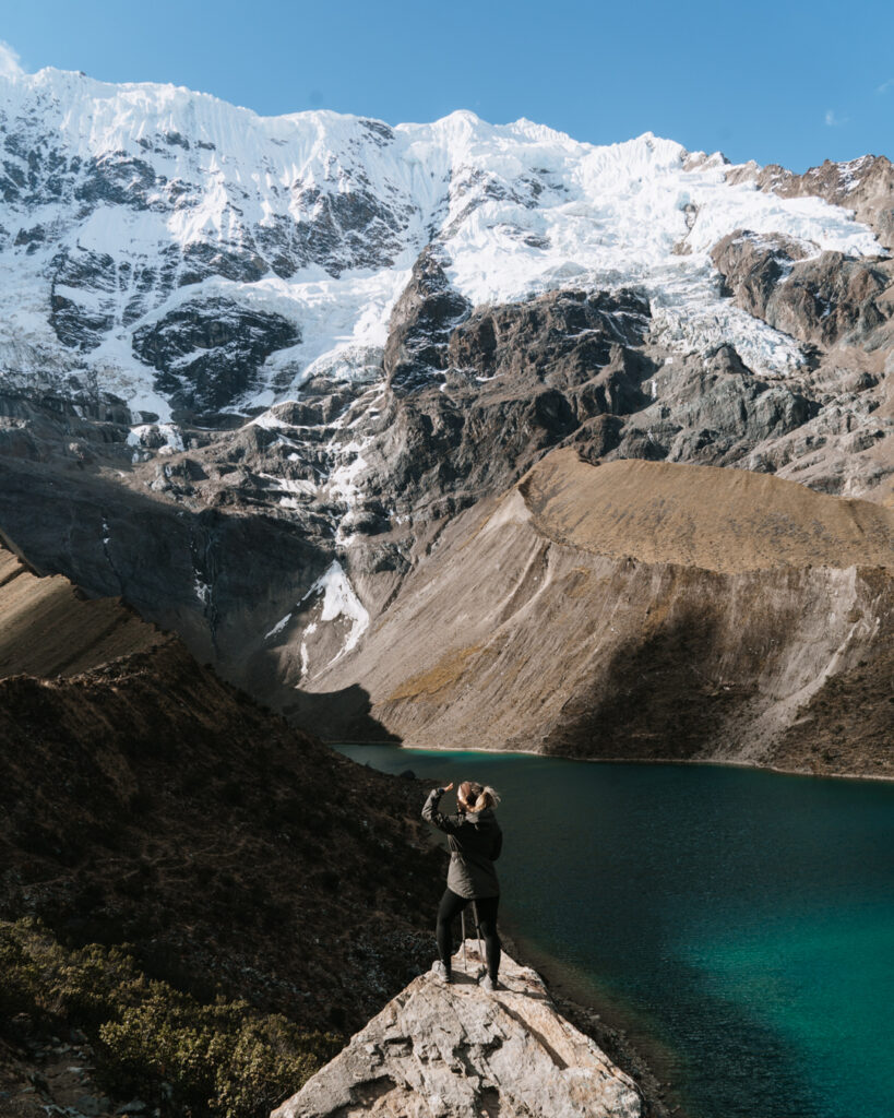 women trekking alone in Peru standing in front of Humantay lake