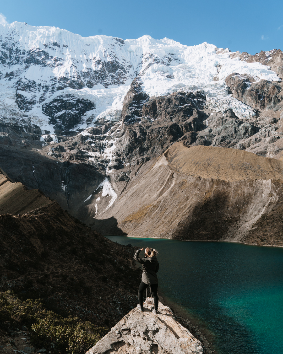 women trekking alone in Peru standing in front of Humantay lake