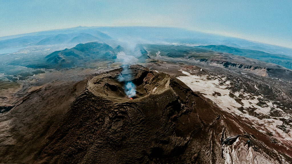 Volcano Villarrica from above looking into the crater to see lava