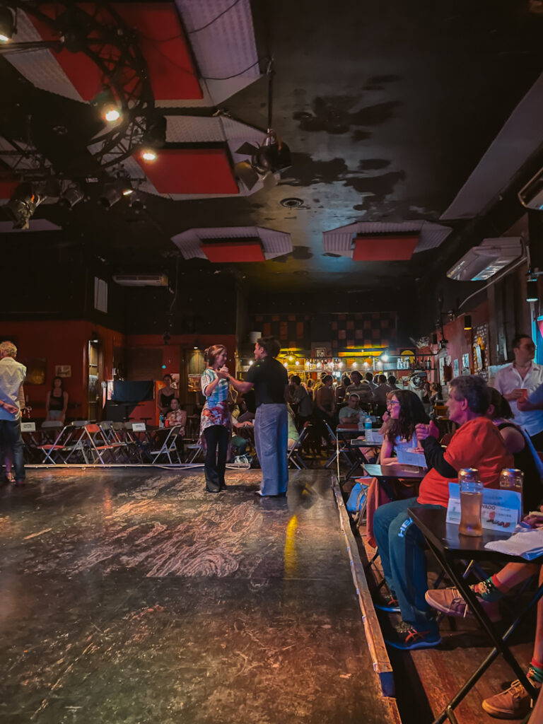 people practicing and learning tango at a milonga in Buenos Aires
