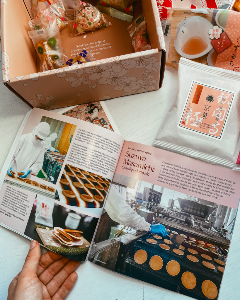Open page of snack guide to Japanese snack box with treats featuring stories of local companies